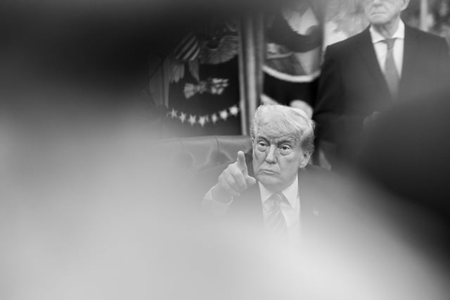 black and white photo of trump pointing