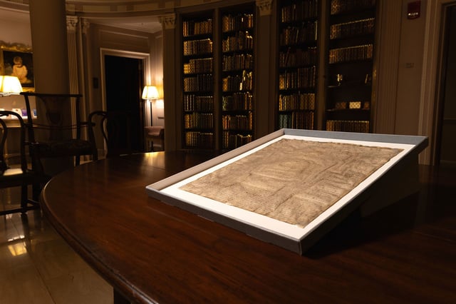 This photo provided by Harvard Law School shows a rare copy of the Magna Carta from 1300 sits in a display case on April 15, 2025, at Harvard Law School in Cambridge, Massachusetts.