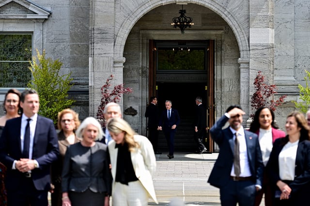 Prime Minister Mark Carney arrives to speak to reporters following a swearing-in ceremony at Rideau Hall in Ottawa, on Tuesday, May 13, 2025. THE CANADIAN PRESS/Spencer Colby