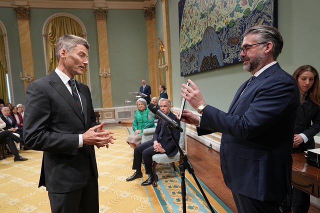 Gregor Robertson, minister of housing and infrastructure and minister responsible for Pacific Economic Development Canada, takes part in the cabinet swearing-in ceremony at Rideau Hall in Ottawa on Tuesday, May 13, 2025. THE CANADIAN PRESS/Christinne Muschi