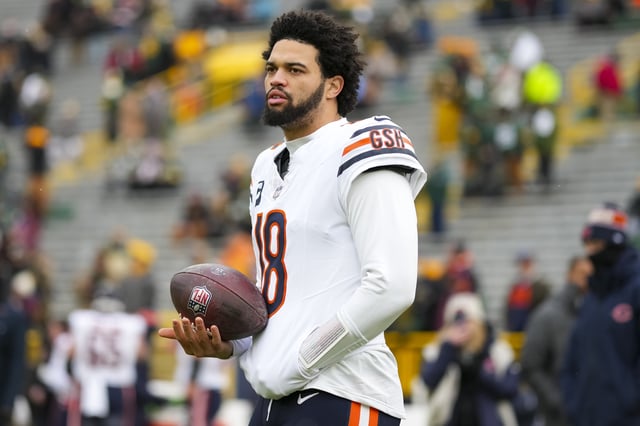 GREEN BAY, WISCONSIN - JANUARY 5: Quarterback Caleb Williams #18 of the Chicago Bears warms up prior to an NFL football game against the Green Bay Packers, at Lambeau Field on January 5, 2025 in Green Bay, Wisconsin.
