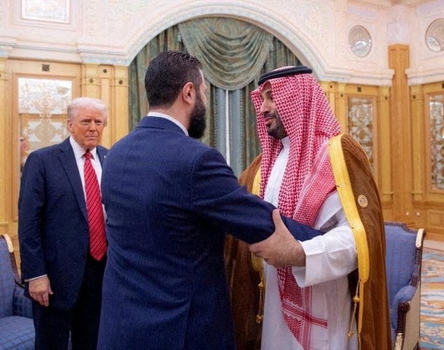 Syrian President Ahmed al-Sharaa meets with U.S. President Donald Trump and Saudi Crown Prince Mohammed Bin Salman in Riyadh, Saudi Arabia, in this handout released on May 14, 2025. Saudi Press Agency/Handout via REUTERS/File Photo