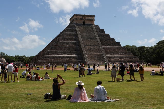 People gather to watch the solar eclipse at the Chichen Itza archaeological zone, in Piste, Mexico, October 14, 2023. REUTERS/Lorenzo Hernandez/File Photo
