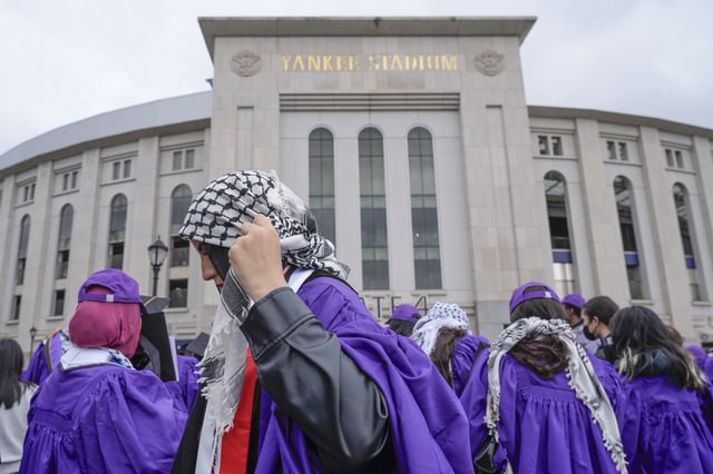 FILE - A few dozen New York University graduates and other supporters of the Palestinian cause rallied outside Yankee Stadium during the NYU commencement ceremony in New York, May 15, 2024. (AP Photo/Seth Wenig, file)