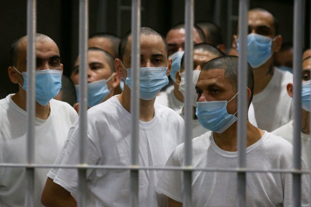 Inmates stand inside a jail during a media tour at the Terrorism Confinement Center (CECOT) prison, in Tecoluca, El Salvador April 4, 2025. REUTERS/Jose Cabezas/File Photo