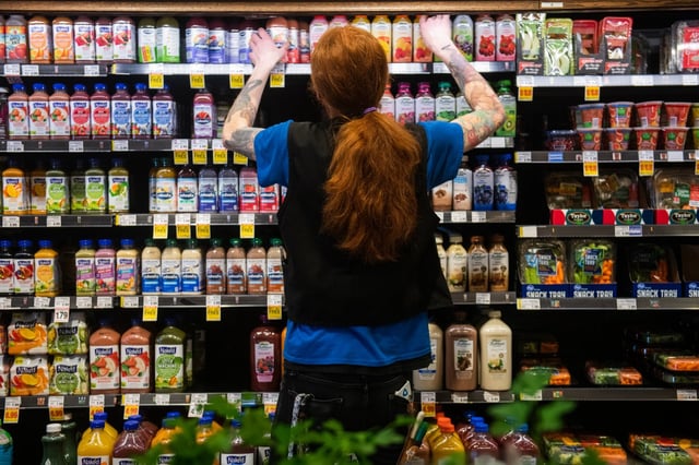 Assistant produce manager Dylan Lund organizes merchandise Monday, March 25, 2019 at the King Soopers on Sheridan Boulevard. UFCW Local 7 union, which represents about 12,200 King Soopers workers, tentatively agreed to terms Monday morning. Details have not been released, and a union vote is required to become ratified. &#34;These kids are scraping by just like I am,&#34; he said.
