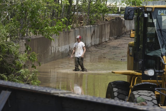 Clean up continues inside the fire station after flooding on Wednesday, May 14, 2025 in Westernport, Md. (AP Photo/Gene J. Puskar)