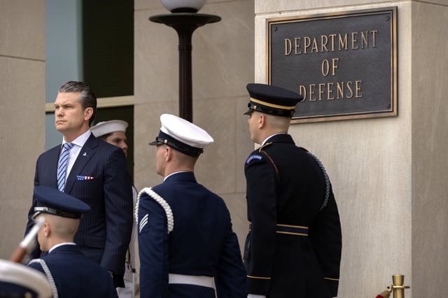 Secretary of Defense Pete Hegseth, left, stands before the arrival of Peru&#39;s Foreign Affairs Minister Elmer Schialer and Peru&#39;s Minister of Defense Walter Astudillo at the Pentagon, Monday, May 5, 2025, in Washington.