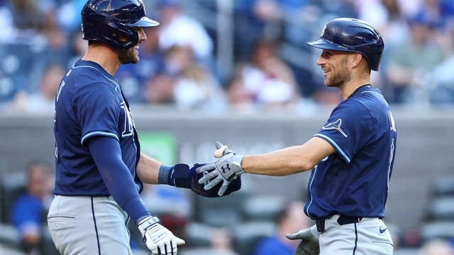 Brandon Lowe (8) of the Tampa Bay Rays celebrates with Josh Lowe (15) after hitting his second two-run home run of the game in the ninth inning against the Toronto Blue Jays at Rogers Centre on Thursday, May 15, 2025, in Toronto. (Vaughn Ridley/Getty Images/TNS)