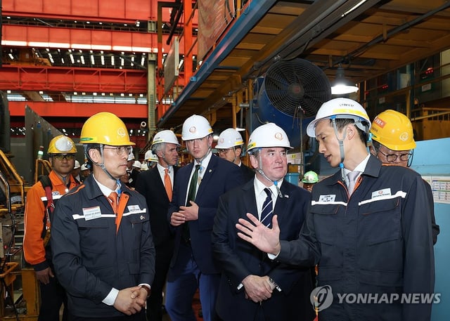 U.S. Secretary of the Navy John Phelan (2nd from R, front row) visits the shipyard of Hanwha Ocean Co. in the southeastern industrial city of Geoje on April 30, 2025, in this file photo released by the company. (PHOTO NOT FOR SALE) (Yonhap)
