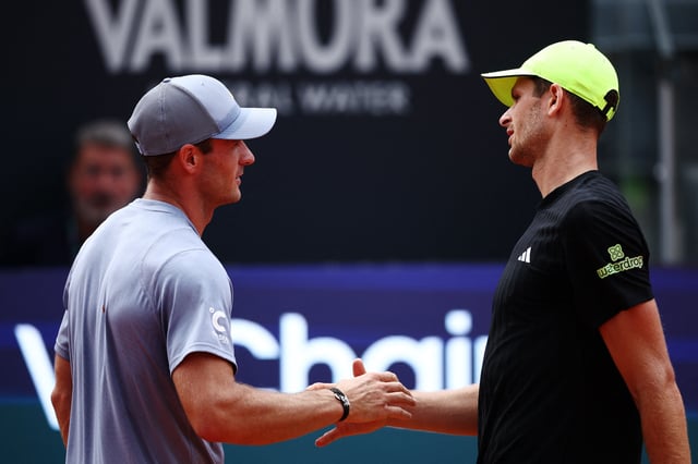 Tennis - Italian Open - Foro Italico, Rome, Italy - May 15, 2025 Tommy Paul of the U.S. shakes hands with Poland's Hubert Hurkacz after winning his quarter final match REUTERS/Guglielmo Mangiapane