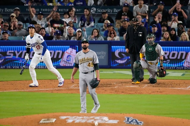 Athletics pitcher Jason Alexander (49) watches a two-run home run hit by  Dodgers’ Shohei Ohtani (17) during the fourth inning of a baseball game Thursday, May 15, 2025, in Los Angeles. (AP Photo/Mark J. Terrill)