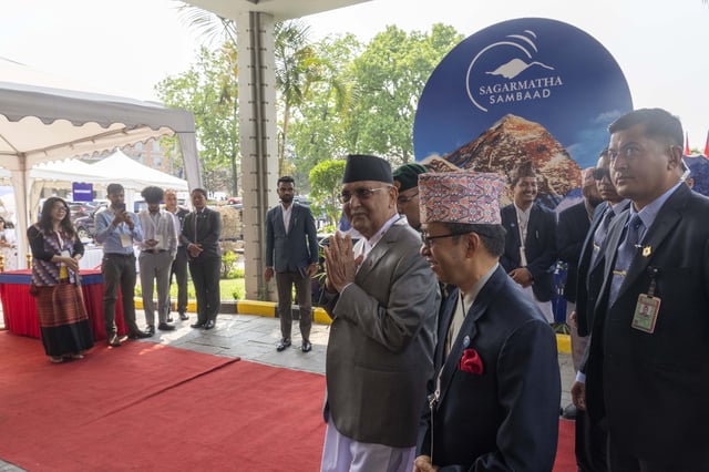 Nepalese Prime Minister Khadga Prasad Oli, center, arrives to participate in an environment conference named Sagarmatha Sambaad (Mount Everest Dialogue) in Kathmandu, Nepal, Friday, May 16, 2025. (AP Photo/Niranjan Shrestha)