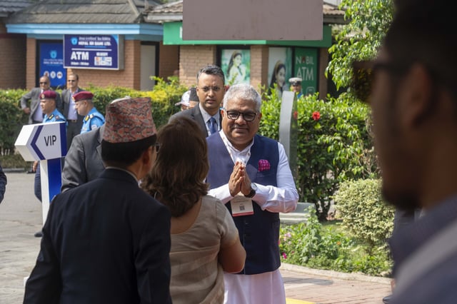 An Indian delegate arrives to participate in an environment conference named Sagarmatha Sambaad (Mount Everest Dialogue) in Kathmandu, Nepal, Friday, May 16, 2025. (AP Photo/Niranjan Shrestha)