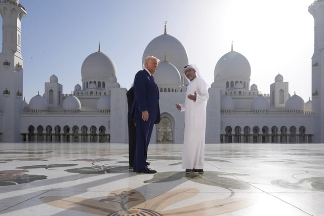 President Donald Trump speaks to Yousif Al Obaidli, director of Sheikh Zayed Grand Mosque, as he tours along with UAE President Mohammed bin Zayed Al Nahyan, left, the Sheikh Zayed Grand Mosque, Thursday, May 15, 2025, in Abu Dhabi, United Arab Emirates.