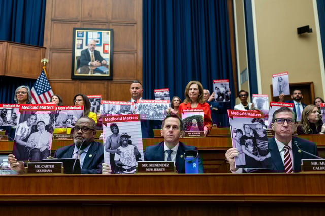 Democratic members of the House Energy and Commerce Committee hold signs with people on Medicaid during a full committee markup session for the Republican’s sweeping domestic policy bill on Capitol Hill in Washington on May 13, 2025. (Eric Lee/The New York Times)