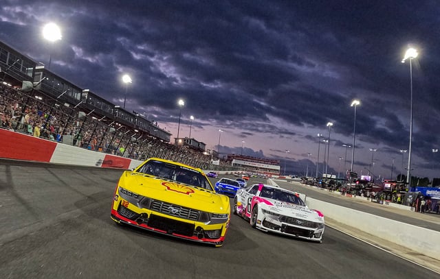 Joey Logano, driver of the #22 Shell Pennzoil Ford, and Brad Keselowski, driver of the #6 Nexlizet Ford, lead the field on a pace lap prior to the NASCAR Cup Series All-Star Race at North Wilkesboro Speedway on May 19, 2024 in North Wilkesboro, North Carolina.