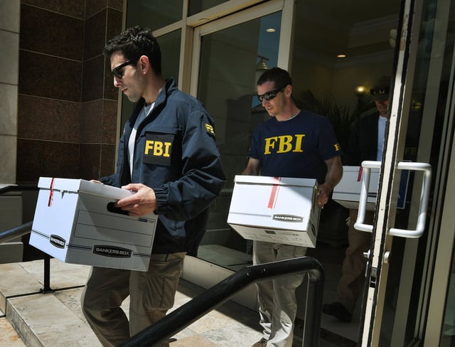 FBI agents investigate an alleged USD 50 million high-end visa fraud scheme involving as many as 100 Chinese nationals in San Gabriel, California on April 5, 2017.