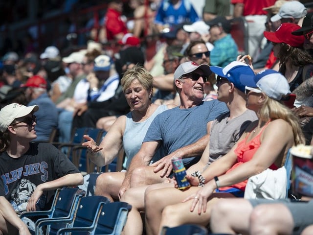  Fans enjoy the warm weather and sunshine during a Vancouver Canadians game at Nat Bailey Stadium.
