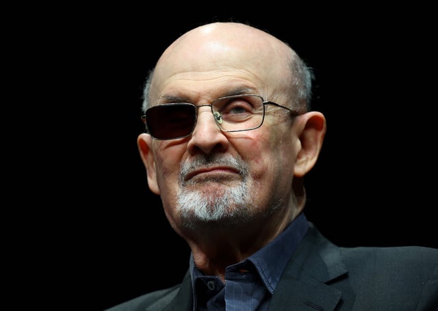 Author Salman Rushdie poses during a photocall ahead of the presentation of his book "Knife: Meditations After an Attempted Murder" at the Deutsches Theater in Berlin, Germany, May 16, 2024. REUTERS/Fabrizio Bensch/File Photo