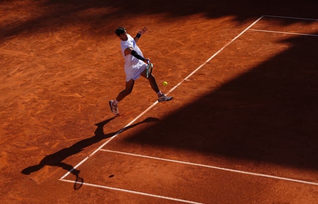Tennis - Italian Open - Foro Italico, Rome, Italy - May 16, 2025 Italy's Lorenzo Musetti in action during his semi final match against Spain's Carlos Alcaraz REUTERS/Aleksandra Szmigiel