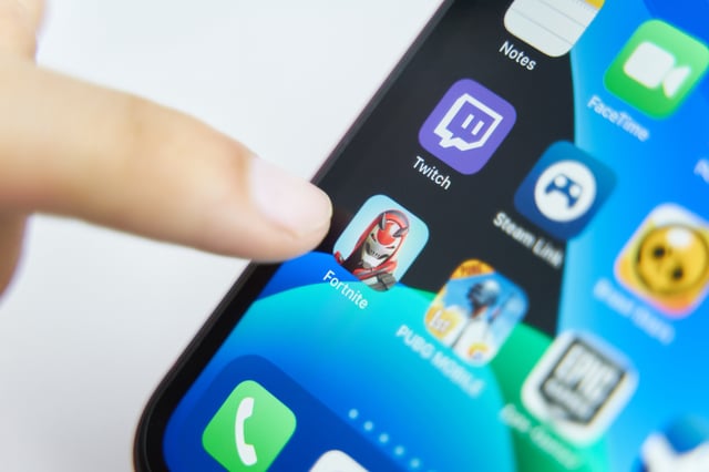 A file photo taken in 2019 shows the Fortnite app on an Apple iOS. Video game company Epic Games claims that Apple blocked access to Fortnite on iPhones.