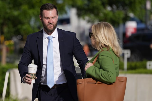 Cade Cothren, the former chief of staff to former Tennessee House Speaker Glen Casada, left, arrives at the federal courthouse with his attorney Cynthia Sherwood, right, Monday, April 28, 2025, in Nashville, Tenn. (AP Photo/George Walker IV)