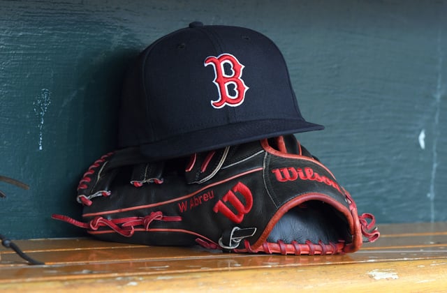 A detailed view of the Wilson baseball glove and New Era hat used by Wilyer Abreu #52 of the Boston Red Sox during the game against the Detroit Tigers at Comerica Park on August 30, 2024 in Detroit, Michigan. The Red Sox defeated the Tigers 7-5 in 10 innings.