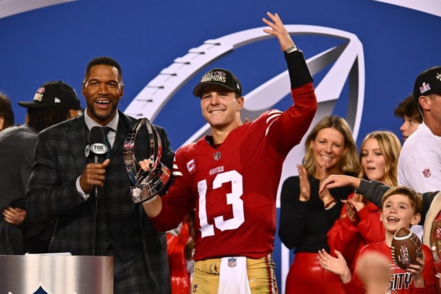 San Francisco 49ers quarterback Brock Purdy (13) celebrates while holding The George Halas trophy after winning the NFC Championship Game at Levi’s Stadium in Santa Clara, Calif., on Sunday, Jan. 28, 2024. The San Francisco 49ers defeated the Detroit Lions 34-31.  (Jose Carlos Fajardo/Bay Area News Group)