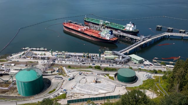 A June 2024 file photo shows a pair of crude oil tankers docked at the Trans Mountain Westridge Marine Terminal, in Burnaby, B.C. Ship tracking data shows China has emerged as the top customer for Canadian oil shipped on the expanded Trans Mountain Pipeline.