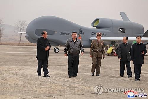 This photo, published by the Korean Central News Agency on March 27, 2025, shows North Korean leader Kim Jong-un (2nd from L) inspecting a defense science research project from March 25-26, 2025. (For Use Only in the Republic of Korea. No Redistribution) (Yonhap)