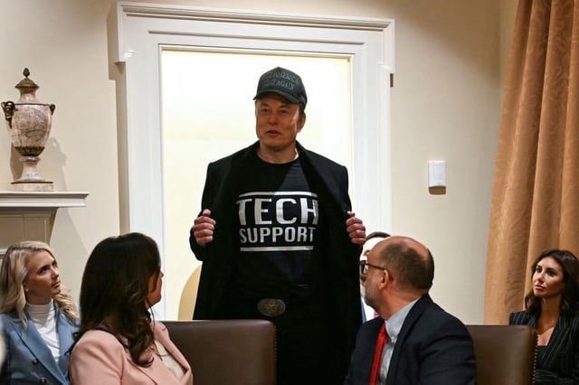 DOGE leader Elon Musk wears a shirt that says "Tech Support" as he speaks during a cabinet meeting with President Donald Trump at the White House in Washington, D.C., on Feb. 26, 2025. (Photo by JIM WATSON/AFP via Getty Images)