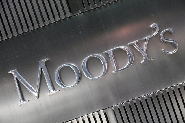 FILE - This Aug. 13, 2010 photo shows a sign for Moody's Corp. in New York. Moody's Investors Service upgraded the outlook for U.S. government debt to "stable" from "negative" and affirmed the United States' blue chip Aaa rating on Thursday, July 18, 2013. The rating agency cited a surprising drop in the federal deficit - the difference between what the government collects in taxes and what it spends. The U.S. government is on track to report its lowest annual deficit in five years. (AP Photo/Mark Lennihan)