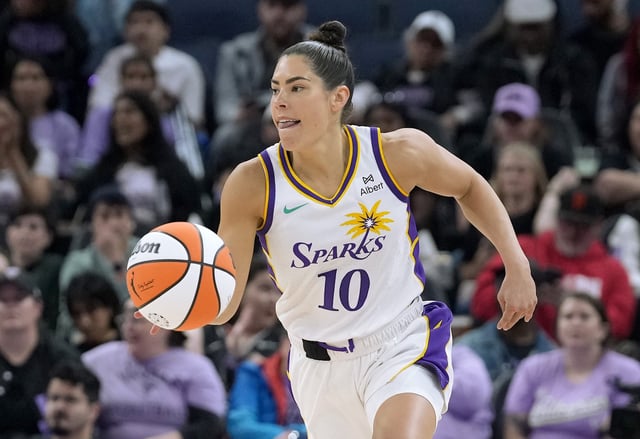 Kelsey Plum #10 of the Los Angeles Sparks dribbles the ball up court against the Golden State Valkyries in the first half of a WNBA basket ball game at Chase Center on May 06, 2025 in San Francisco, California.