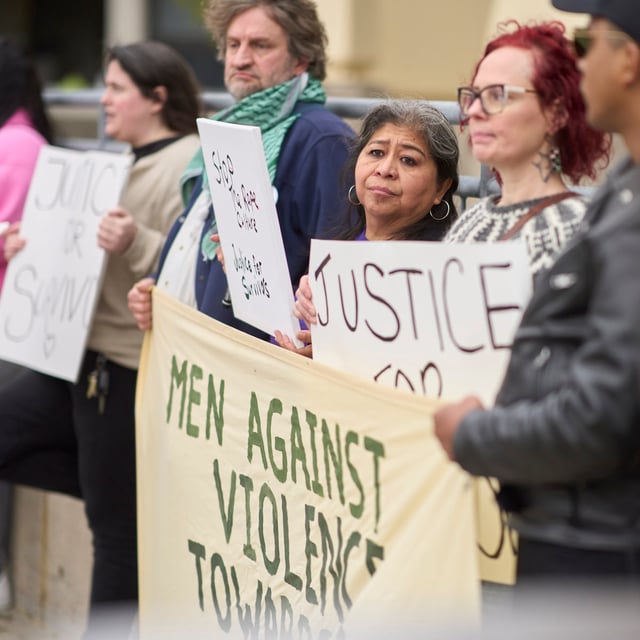 Protestors raising awareness for sexual assault survivors protest outside the courthouse in London, Ont., Friday, May 2, 2025. The sexual assault trial of five former members of Canada’s world junior hockey team continues today. THE CANADIAN PRESS/Geoff Robins
