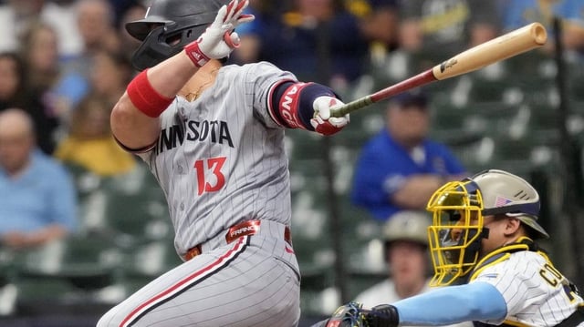 Minnesota Twins first baseman Ty France (13) hits an RBI single during the first inning against the Brewers on Friday at American Family Field in Milwaukee.