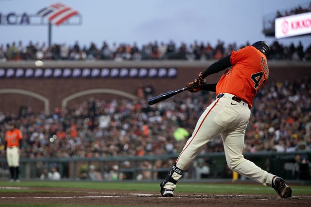 May 16, 2025; San Francisco, California, USA; San Francisco Giants first baseman Wilmer Flores (41) connects for a grand slam against the Athletics during the third inning at Oracle Park. D. Ross Cameron-Imagn Images