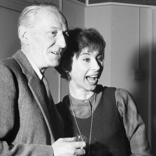 The Doctor (William Hartnell) and Susan (Carole Ann Ford) toast "Doctor Who" before the first episode airs in 1963.