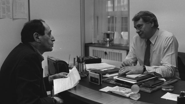 Glanville, left, talking to England manager Bobby Robson in 1989