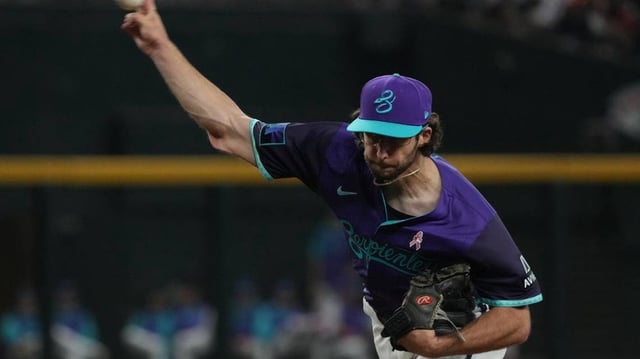 May 11, 2025; Phoenix, Arizona, USA; Arizona Diamondbacks pitcher Zac Gallen (23) throws against the Los Angeles Dodgers in the first inning at Chase Field. Mandatory Credit: Rick Scuteri-Imagn Images