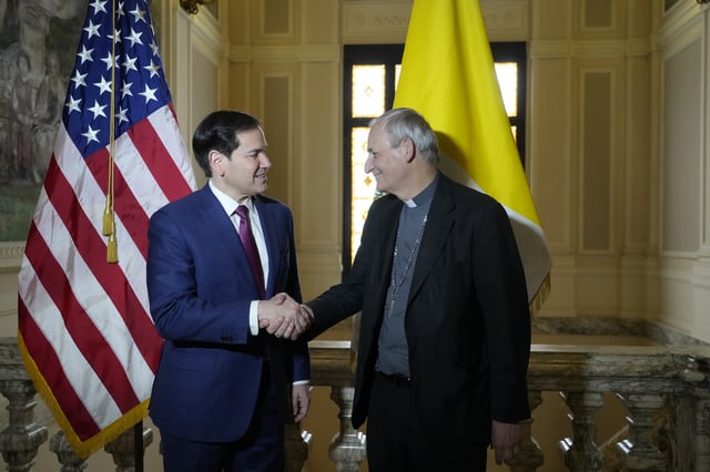 Secretary of State Marco Rubio, left, and President of the Conference of Italian Bishops, Cardinal Matteo Zuppi, pose for a photo at the U.S. Embassy to the Holy See in Rome, Saturday, May 17, 2025. (AP Photo/Gregorio Borgia)