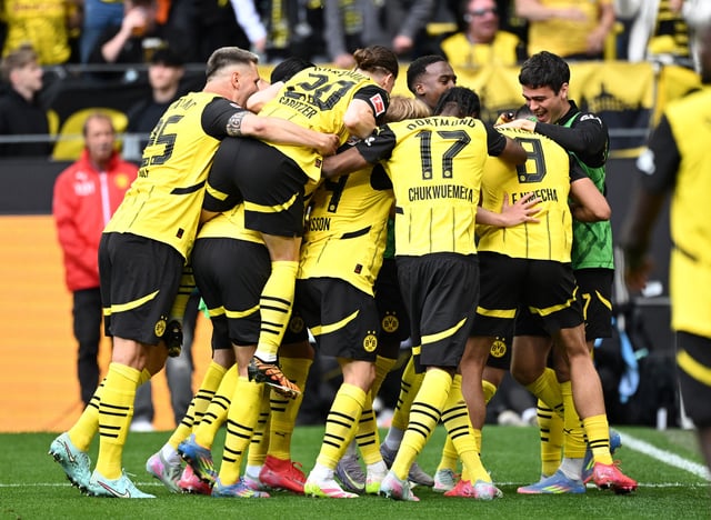 Soccer Football - Bundesliga - Borussia Dortmund v Holstein Kiel - Signal Iduna Park, Dortmund, Germany - May 17, 2025 Borussia Dortmund's Felix Nmecha celebrates scoring their third goal with teammates REUTERS/Annegret Hilse