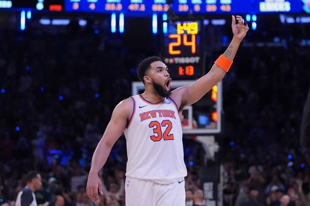 New York Knicks&#39; Karl-Anthony Towns (32) gestures to the crowd during the second half of Game 6 in the Eastern Conference semifinals of the NBA basketball playoffs against the Boston Celtics Friday, May 16, 2025, in New York. (AP Photo/Frank Franklin II)