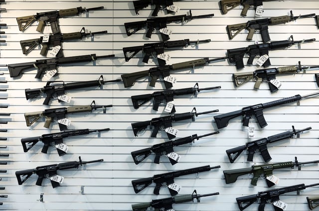 Semi-automatic rifles on display at R Guns on April 29, 2023, in Carpentersville, Illinois.