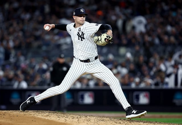 Oct 28, 2024; New York, New York, USA; New York Yankees pitcher Jake Cousins (61) throws during the sixth inning against the Los Angeles Dodgers in game three of the 2024 MLB World Series at Yankee Stadium. Mandatory Credit: Wendell Cruz-Imagn Images/File Photo