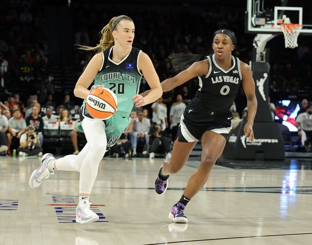 Sabrina Ionescu #20 of the New York Liberty drives against Jackie Young #0 of the Las Vegas Aces in the third quarter of Game Four of the 2024 WNBA Playoffs semifinals at Michelob ULTRA Arena on October 06, 2024 in Las Vegas, Nevada. The Liberty defeated the Aces 76-62 to win the series three games to one.