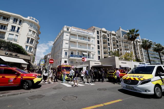 French police and emergency services secure an area after a passerby was injured when a palm tree fell on the Boulevard de la Croisette during the 78th Cannes Film Festival in Cannes, France, May 17, 2025. REUTERS/Benoit Tessier