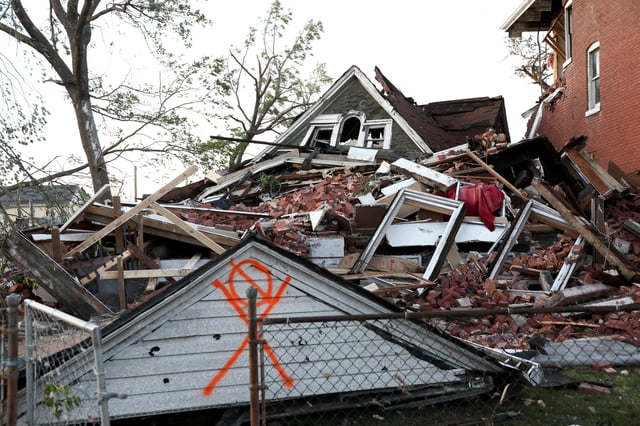 A house lies completely collapsed under a mountain of bricks, after a tornado struck in St. Louis, Missouri,U.S. May 16, 2025. REUTERS/Lawrence Bryant