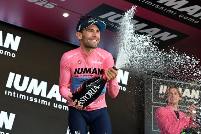 Cycling - Giro d'Italia - Stage 8 - Giulianova to Castelraimondo - Italy - May 17, 2025  XDS Astana Team's Diego Ulissi celebrates wearing the maglia rosa jersey after stage 8 REUTERS/Jennifer Lorenzini