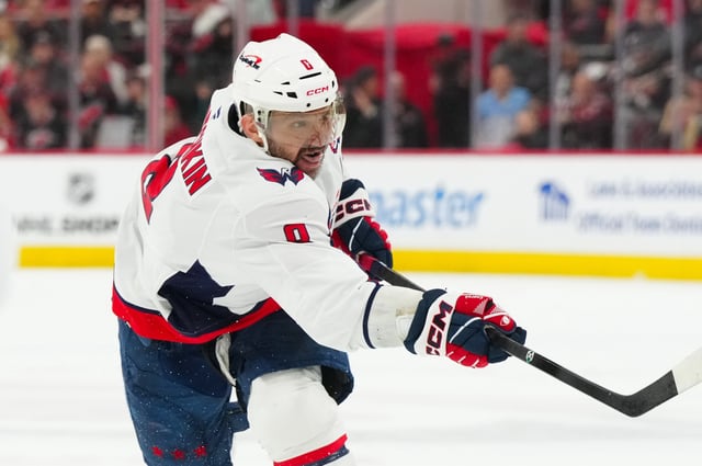 May 10, 2025; Raleigh, North Carolina, USA; Washington Capitals left wing Alex Ovechkin (8) takes a shot against the Carolina Hurricanes during the second period in game three of the second round of the 2025 Stanley Cup Playoffs at Lenovo Center. Mandatory Credit: James Guillory-Imagn Images/File Photo
